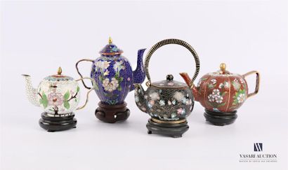 null Partitioned enamel set comprising four miniature teapots, the first one of ovoid...
