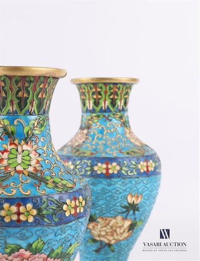 null Pair of baluster-shaped vases in partitioned enamels, the belly with polychrome...