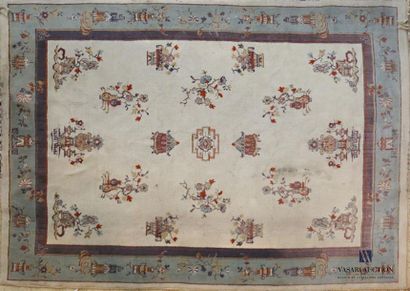 null CHINA 
Wool carpet decorated with branches and flower pots on a beige 
background...