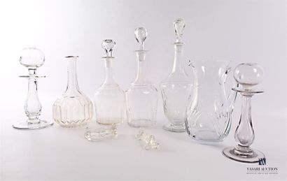 null Glass set including four decanters, one with crosspiece decoration, two with...