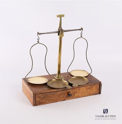null A stumbling block scale on a wooden base opening through a drawer, the bronze...