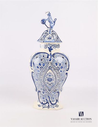 null A vase covered with white earthenware baluster frome covered with a blue monochrome...