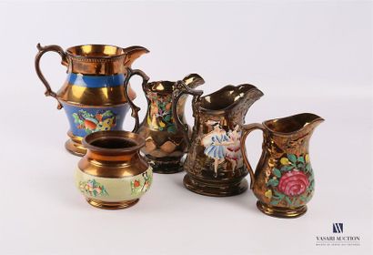 null JERSEY 
Set of four jugs and a glossy slip earthenware vase with floral and...