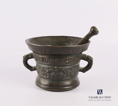 null Mortar and its bronze pestle of flared shape, the belly decorated with two friezes...