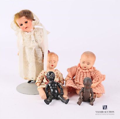 null Set of dolls including a German porcelain doll marked at the nape of the neck...