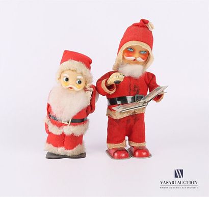 null Two Santa Claus toys in sheet metal, plastic and fabric, one holding a picture,...