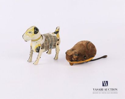 null Two mechanical sheet metal toys, one of German manufacture featuring a dog dressed...