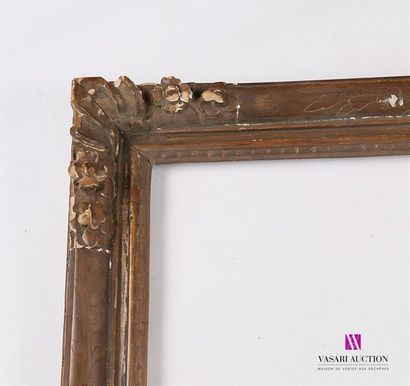 null A set of frames comprising : 
- Moulded, carved and patinated wooden frame called...