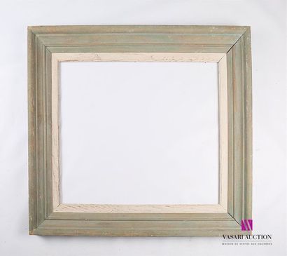 null A set of frames comprising : 
- Moulded, carved and patinated wooden frame called...