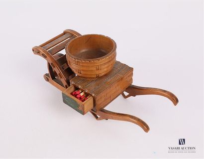 null Matchbox in the shape of a wooden wheelbarrow, the support simulating a wicker...