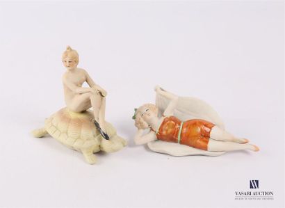 null GERMANY, manufacture
Set of two painted biscuit bathers, one lying down holding...
