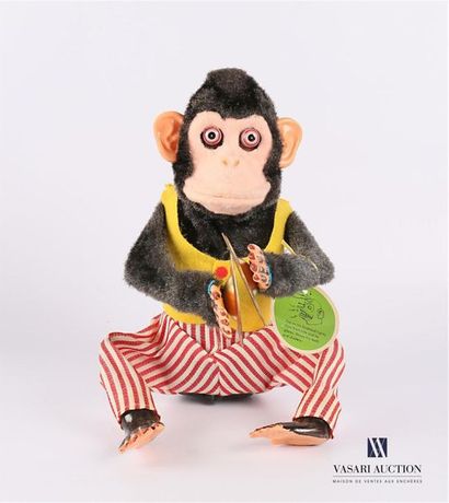 null BANDAI - Japon 
" Musical Jolly Chimp " Jouet représentant un signe au gilet...