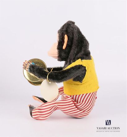 null BANDAI - Japan 
" Musical Jolly Chimp " Toy representing a sign with a yellow...