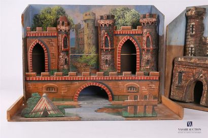 null Set of two wooden and cardboard decorations depicting fortresses, one showing...