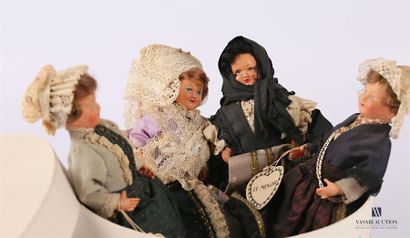 null THE MINOR
Lot of four dolls in composition and fabric in regional clothing including...