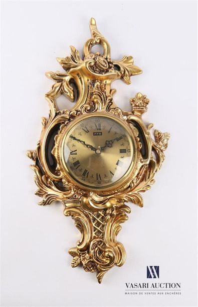 null A gilded resin applique clock, the round champagne-coloured dial indicating...