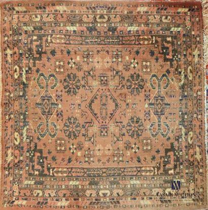 null MIDDLE EAST 
Square wool carpet decorated with geometric and floral motifs on...