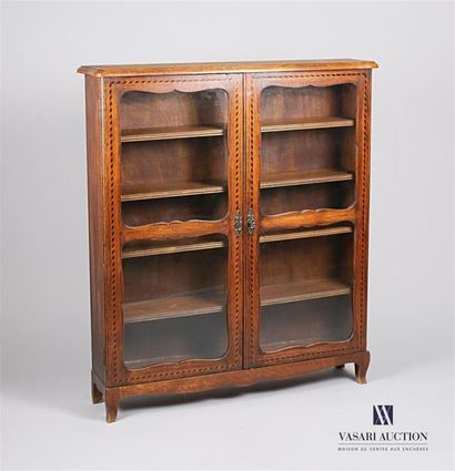 null A walnut and veneer display case, it opens on the front with two glass leaves...