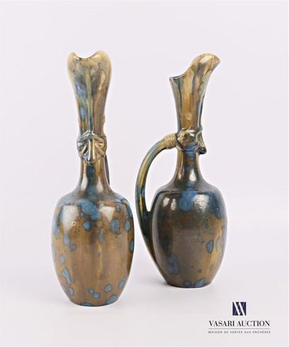 null PIERREFONDS Manufacture de
Pair of glazed stoneware ewers, the neck decorated...