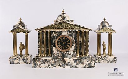 null A chimney piece in grey breche marble and gilded metal, the clock running away...
