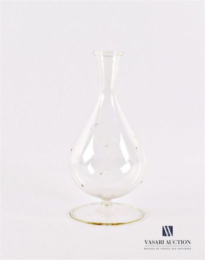 null Blown glass bottle of ovoid shape decorated with pellets on the belly, it rests...