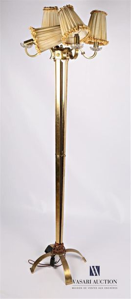 null Floor lamp in bronze and brass resting on an arched quadripod base, the tapered...