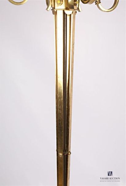 null Floor lamp in bronze and brass resting on an arched quadripod base, the tapered...