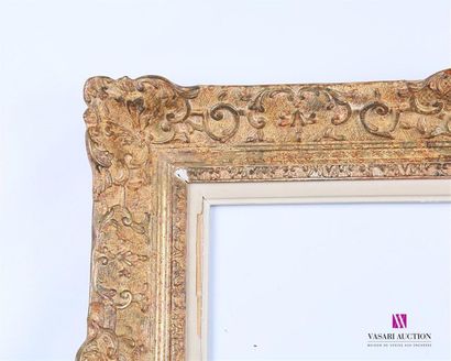null Set of five Frames including : 
Moulded, carved and lacquered wooden frame with...