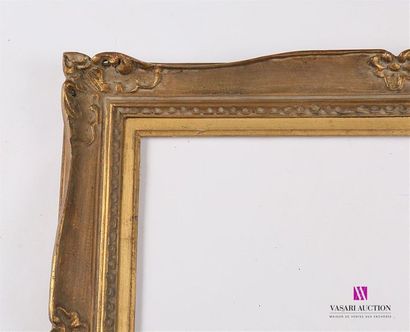 null A set of frames comprising : 
- Moulded wooden frame with groove decoration...
