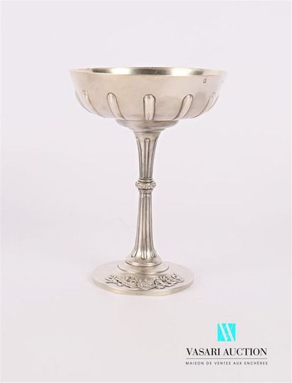 null Cup on a silver pedestal, the belly is gadrooned, the barrel is fluted, the...