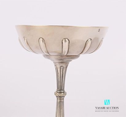 null Cup on a silver pedestal, the belly is gadrooned, the barrel is fluted, the...