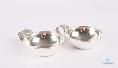 null Pair of plain silver tastevins, the rolled handle decorated with a bunch of...