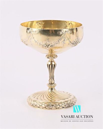 null Gilt silver chalice, the goblet decorated with floral festoons, the baluster...