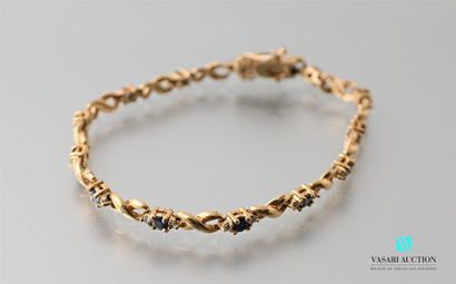 null Bracelet in golden metal decorated with fancy stones.