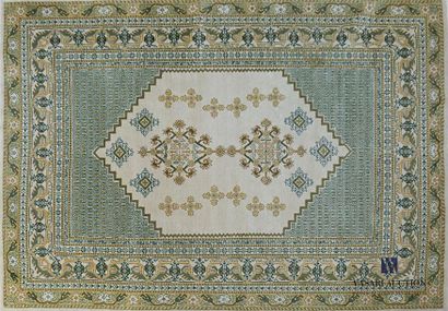 null Woollen carpet decorated with a central hexagonal medallion in a repeating geometrical...