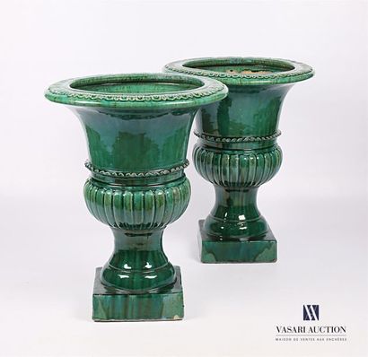 null Pair of Medici vases in green glazed terracotta decorated with a frieze of wavelets...