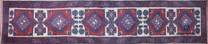 null TURKEY 
Woolen gallery decorated with medallions with red backgrounds in repetition...
