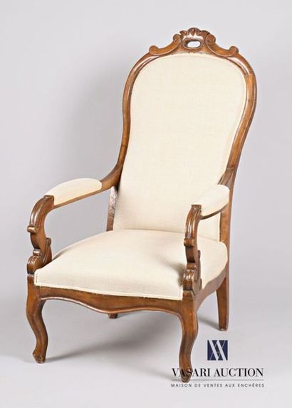 null Voltaire armchair in moulded and carved natural wood, the slightly sloping back...