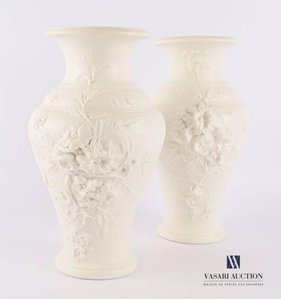 null Pair of moulded biscuit vases in baluster shape with a revolving decoration...