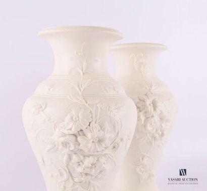 null Pair of moulded biscuit vases in baluster shape with a revolving decoration...