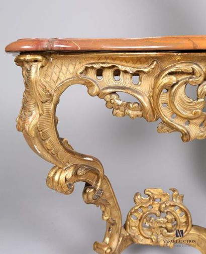 null Moulded, sculpted and gilded wooden console with a curved front and sides, the...