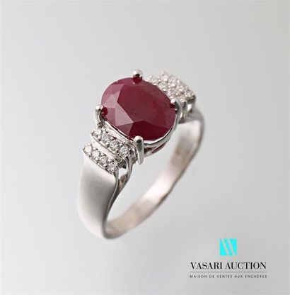 null A 750 thousandths white gold ring set with an oval ruby of approximately 2.92...