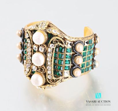 null CHANEL 
Open cuff bracelet in gold metal paved with green and white rhinestones...