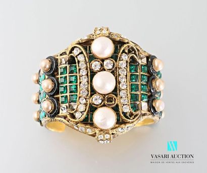 null CHANEL 
Open cuff bracelet in gold metal paved with green and white rhinestones...