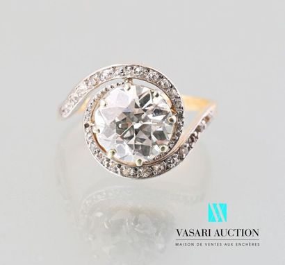 null A 750 thousandths gold tourbillon ring set with a half-cut diamond of approximately...