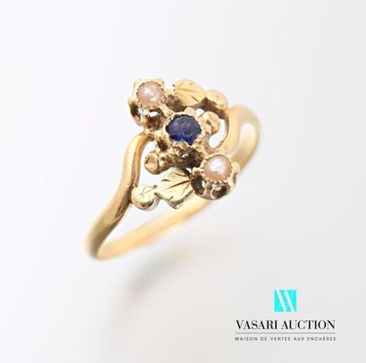 null Two-tone gold ring decorated with flowers and foliage in the center set with...
