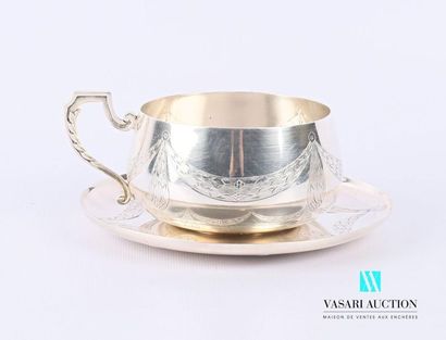 null Chocolate cup and its under-cup in silvery metal decorated with festooned laurel...