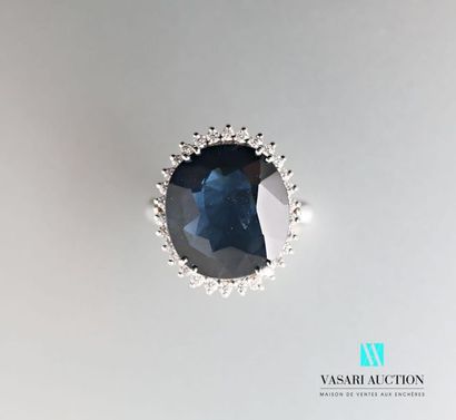 null 750 thousandths white gold ring set with an oval sapphire accompanied by its...