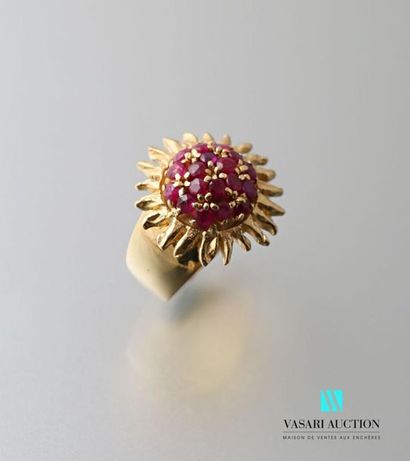 null 750 thousandths yellow gold ring with a large ring decorated with a central...