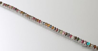 null Silver line bracelet decorated with multicolored tourmalines, the ratchet clasp...
